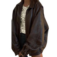 Embrace the spirit of the '90s with this oversized vintage dark brown lamb leather bomber jacket. Made from luxurious waxed lamb leather, this piece boasts a soft, supple feel that elevates any outfit. The oversized silhouette offers a relaxed, laid-back vibe, making it perfect for layering over your favorite tees or sweaters. With its classic bomber design, ribbed cuffs, and hem, this jacket combines comfort and style effortlessly. The rich dark brown hue adds a touch of sophistication, while the subtle sheen from the waxed finish gives it a unique character. Functional pockets provide practicality without sacrificing style, making it a versatile staple for any wardrobe. Whether you're heading out for a casual day or dressing up for a night on the town, this vintage bomber jacket is the p Wishlist 2024, Baggy Style, Women Overcoat, Womens Jackets, Real Leather Jacket, Vintage Leather Jacket, Brown Leather Jacket, Brown Jacket, Leather Jackets Women