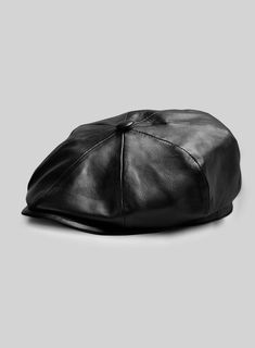 Our Newsboy Leather Cap is the perfect blend of old and new, with its vintage '20s look and modern leather construction.    Featuring an eight-panel construction and iconic top button for a classic look, plus a sleek inner viscose lining for comfort and style, this cap will make an impression in any era!  
 
 Made Using Pure Napa Sheep Skin Soft Leather.  
 
 Add a touch of flair to a casual ensemble with this stylish cap. Classic Leather Hat With Flat Bill, Classic Leather Flat Bill Hat, Classic Adjustable Six-panel Beret, Retro Leather Cap, Stylish Caps, Sheep Skin, Leather Cap, Classic Looks, Old And New