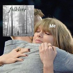 two people hugging each other in front of trees and the words folklore me on them