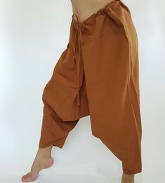 "⬇️ SHOP HERE https://www.etsy.com/ch-en/shop/IndycraftsDesigns Aladdin Pants, Harem Pants 100% Cotton Unisex pants, perfect for yoga, The fabric is cotton soft, lightweight, and airy, ideal for those warm days. If it's a bit chilly, you could always wear leggings underneath. super comfortable cotton pants made of light, comfortable to wear 100% cotton. Cotton is a natural material that wicks moisture to keep you cool, comfy & dry. Floral printed, elastic waistband,medium-weight, Soft and Co Baggy Brown Festival Pants, Brown Baggy Pants For Festival, Brown Harem Pants With Pockets, Traditional Brown Cotton Bottoms, Brown Baggy Bottoms For Festival, Brown Harem Bottoms With Pockets, Baggy Brown Harem Bottoms, Brown Harem Bottoms For Yoga, Traditional Brown Harem Pants