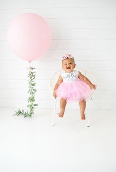 This beautiful, fluffy pink dress is sure to make her feel like a princess on her birthday! Graphic is made in a non-shedding, super sparkly, glitter media, that is washable and durable. Our dresses used are only of the highest quality, with soft fabrics and quality trims. BACK TO OUR SHOP: http://www.babysquishycheeks.etsy.com CHECK OUT OUR PIGGY PETALS, the perfect addition: https://www.etsy.com/shop/BabySquishyCheeks?ref=hdr_shop_menu&section_id=13558574 OTHER GREAT BIRTHDAY OUTFITS: http Pink Ruffled Princess Dress For First Birthday, Princess Tutu Dress With Ruffles For First Birthday, Pink Princess Tutu Dress For Cake Smash, Princess Pink Tutu Dress For Cake Smash, Pink Princess Dress For Cake Smash, Pink Ruffled Princess Dress For Birthday, Pink Tulle Tutu Dress For Cake Smash, Pink Sleeveless Princess Dress For Birthdays, Pink Sleeveless Princess Dress For Birthday