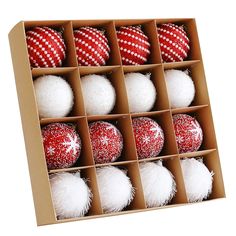 twelve red and white christmas ornaments in a cardboard box