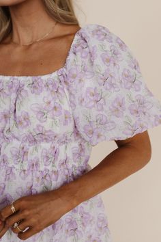 Get ready to turn heads in the Janey Textured Midi Dress in Lavender Floral! With its delicate lavender floral print, puffy sleeves, and flattering elastic waist, this midi dress is sure to become your go-to for any occasion. Fully lined Pockets Elastic waist Puff sleeve Round neck Midi length Lavender floral pattern Self 100% polyester, lining 100% polyester Dress fits true to size. Small (0-2), Medium (4-6), Large (8-10), X-Large (10-12), 1X-Large (12-14), XX-Large (16-18), XXX-Large (18-20). Modest Lavender Dress, Purple Dresses, Church Dress, Wedding Photographer Outfit, Happy Threads, Sunday Dresses, Summer Goddess, Photographer Outfit, Pink Desert