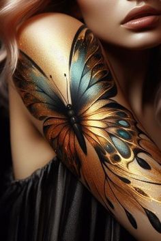 a woman's arm with a butterfly painted on it and her hair blowing in the wind