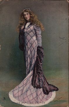 an old fashion photo of a woman in a dress