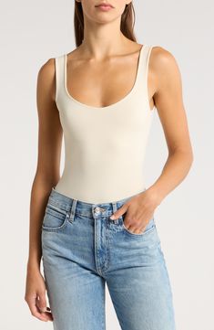 A sleek curve-hugging bodysuit featuring a dipped neckline and low U-back. Stretch fit Built-in shelf bra Snap gusset closure Thong cut 92% nylon, 8% elastane Machine wash, dry flat Imported Shelf Bra, Clean Lines, Built In Shelves, Free Fabric, Anniversary Sale, Fabric Gifts, Sleek, Free People, Fitness Motivation