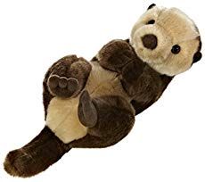 a stuffed animal that is laying down on its back with it's legs spread out