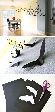 some paper bats are on the floor and one is cut out to look like batmans