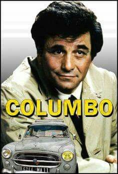 a man in suit and tie next to a car with the words columbia on it