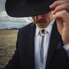 Wild Horse Bolo Tie | Montana Silversmiths Western Groom Attire Bolo Tie, Navy Suit Bolo Tie, Luxury Handmade Bolo Ties As Gift, Bolo Tie Men Wedding, Bolo Tie Groomsmen, Bolo Tie Wedding Groom, Bolo Tie Aesthetic, Bolo Tie Men Outfit, Western Lariat Bolo Tie For Rodeo