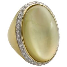 Bold and Fashionable Lemon QUARTZ over Mother-of-Pearl Ring with DIAMONDS in bright and rich 18k Yellow Gold. A real fun Statement jewel, a gear Right Hand or Anniversary Ring! From our Estate Collection. The ring is in 18K Yellow GOLD with satin finish. The Cabochon Gold Lemon Quartz set over Mother-of-Pearl that gives incredible , one of a kind glow within the Gemstone and surrounded by small Brilliant Diamonds, approx. 0.95ct, G-H color VS-SI in clarity over all. Well matched and brilliant. V Lemon Quartz Ring, Estate Rings, Diamond Cocktail Rings, White Gold Diamond Rings, Lemon Quartz, Domed Ring, Pearl Diamond, Quartz Ring, Yellow Gold Ring