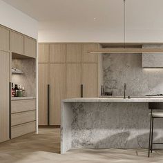 a kitchen with marble counter tops and stools next to an island in the middle