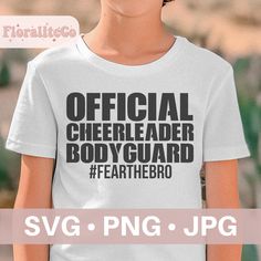 a young boy wearing a white shirt with the words official cheerleader body guard on it