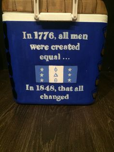 a blue cooler bag with white writing on it and an image of a flag that says in 1876, all men were created equal