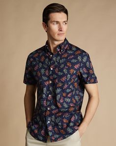 100% cotton, Available in classic and slim fit, In house designs, exclusive to CT, Non-iron with added stretch, Button-down collar, Short sleeve, Classic and slim fit: back pleats, Machine washable - Non-Iron Leaf Print Short Sleeve Shirt - Navy | Men's Charles Tyrwhitt Non-Iron Leaf Print Short Sleeve Casual Shirt - Navy Blue Size Large Cotton Casual Fitted Short Sleeve Shirt With Placket, Fitted Casual Short Sleeve Shirt With Placket, Fitted Cotton Short Sleeve Shirt With Spread Collar, Fitted Short Sleeve Shirt With Spread Collar, Fitted Cotton Button-up Short Sleeve Shirt, Slim Fit Short Sleeve Cotton Button-up Shirt, Slim Fit Cotton Short Sleeve Button-up Shirt, Fitted Short Sleeve Cotton Shirt With Collar, Fitted Cotton Collared Short Sleeve Shirt