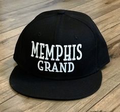 Our Awesome Signature Memphis Grand Cap, it doesn't get any better than this! 3D Embroidered White Letters on a Black New Era 9Fifty Snap Back High Crown Flat Brim Cap! Of course you can put a little curve on the brim to your liking! High Profile "Trucker Crown" style! 100% Cotton, one size adjustable. We have this cap embroidered right here in Fort Worth, TX by our good friends at The Skinny Armadillo! Make sure you tag us in your pictures! #MemphisGrandStyle #MemphisGrandGirls Adjustable Snapback Flat Cap For Outdoor, Adjustable Outdoor Snapback Flat Cap, Adjustable Flat Cap Snapback For Outdoor, Hip Hop Style Outdoor Hat, Urban Style Fitted Hat For Outdoor, Adjustable Snapback Hat With Letter Print, Urban Adjustable Baseball Cap For Outdoor Activities, Urban Style Adjustable Baseball Cap For Outdoor Activities, Urban Fitted Cap For Outdoor