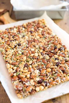 a wooden table topped with lots of granola bars