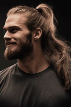 For men with long hair, a tight high ponytail offers an updated twist on the classic hairstyle. This versatile long hairstyle works well with wavy hair and can be secured using a strong hold gel. Click here to check out more irresistible long hairstyles for men. Guys With Ponytails, French Braid Ponytail, Short Beard, Braided Ponytail Hairstyles, Short Layered Haircuts, Men Haircut Styles, Classic Hairstyles, High Ponytails