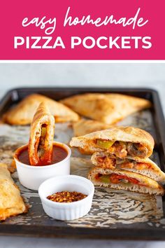 easy homemade pizza pockets on a tray with dipping sauce