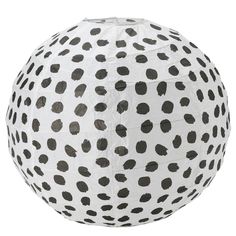 a large white and black polka dot paper ball on a white background with grey spots