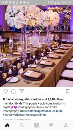 a long table is set with white flowers and place settings for the guests to sit at