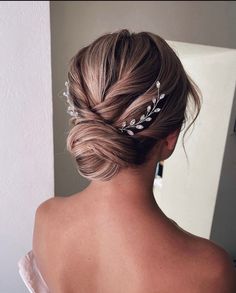 a woman wearing a wedding hair comb