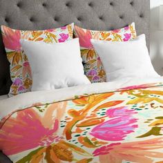 an image of a bed with colorful flowers on it