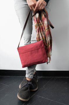 "The Marabara Day bag has been designed to accompany you every day. It is made of cotton canvas in a nice burgundy colour. Don't be tricked by its small size, this bag is roomy enough to carry all your daily essentials (wallet, phone, notebook, sunglasses...) and it's light as a feather. You won't even notice you are carrying it, so comfortable that you will want to take it with you all the time. It closes with a metal zipper and comes with an adjustable leather strap, in chocolate colour. It is Casual Burgundy Bags For Daily Use, Casual Burgundy Shoulder Bag For Everyday Use, Casual Burgundy Shoulder Bag For Everyday, Casual Everyday Burgundy Shoulder Bag, Cotton Crossbody Bag With Removable Pouch, Casual Red Cotton Shoulder Bag, Red Casual Cotton Shoulder Bag, Everyday Cotton Crossbody Shoulder Bag, Cotton Satchel With Removable Pouch For Daily Use