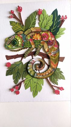 an intricately designed greeting card featuring a chamelon on a branch with leaves and berries