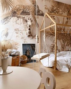 a bedroom with a canopy bed and wallpaper