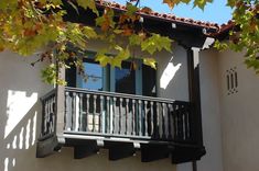 an apartment building with balcony and balconies