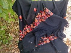 Soft Black Scarf with Floral Embroidery, Womens Wrap  🎓 Item Description & Materials 🎓 Very soft black long scarf with machine embroidered flowers  in bright colors  and 2 inches fingers for women. The scarf is not used and in very good condition 📏 Sizing 📏 Dimensions: 74 x 27 inches ( 2 inches fingers ) 188 x 68 cm ( 5 cm fingers ) All of the pictures are genuine and taken by me. You get the exact item in the pictures. If you have any questions or want additional pictures, please do not hesitate to ask. 🔎 Related Pieces🔎 For more vintage finding follow this link: https://www.etsy.com/shop/ClioVintageFinds?ref=shop_sugg_market Thank you for visiting my shop and supporting my little business ! Traditional Embroidered Winter Scarves, Traditional Floral Embroidered Shawl For Winter, Traditional Winter Shawl With Floral Embroidery, Winter Festive Embroidered Scarves, Traditional Black Festive Scarves, Traditional Black Scarves For Festive Occasions, Folk Style Shawl With Floral Embroidery, Folk Style Black Shawl For Winter, Embroidered Black Shawl Dupatta