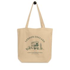 Cute green London England tote bag perfect for trips to the farmer's market this fall! If you're interested in a custom color or design then please reach out! Say goodbye to plastic, and bag your goodies in this organic cotton tote bag. There's more than enough room for groceries, books, and anything in between. 🤎 Product Details: * 100% certified organic cotton 3/1 twill * Fabric weight: 8 oz/yd² (272 g/m²) * Dimensions: 16″ × 14 ½″ × 5″ (40.6 cm × 35.6 cm × 12.7 cm) * Weight limit: 30 lbs (13.6 kg) * 1″ (2.5 cm) wide dual straps, 24.5″ (62.2 cm) length * Open main compartment * Blank product components sourced from Vietnam 🤎 Unique Designs: All designs are uniquely created and printed onto our apparel and accessories. Our designs are meant to inspire and comfort, so if you would like t Eco-friendly Green Canvas Bag For Travel, Eco-friendly Tote Bags For Grocery Shopping, Eco-friendly Tote Bags For Grocery, Eco-friendly Rectangular Shoulder Bag For Grocery, Eco-friendly Green Grocery Bags, Green Tote Shoulder Bag For Weekend Trips, Eco Tote Bag, London England, Baby Bag