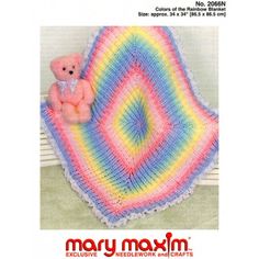 there is a crocheted blanket with a teddy bear on it and the pattern has been made