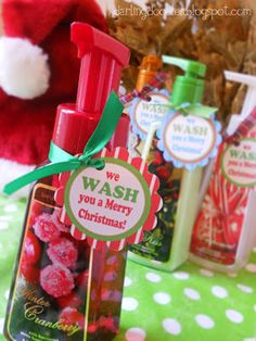 two bottles of wash sitting on top of a green and white polka dot table cloth