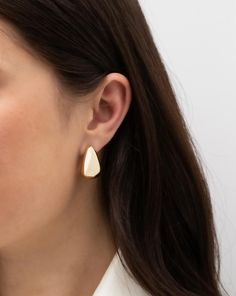 Bolder Is Better: These on-trend statement earrings are a must-have addition to your jewelry wardrobe. The epitome of versatility, they can easily dress up a t-shirt and jeans, or, can be worn to perfectly complement a gown. Modern Teardrop Clip-on Earrings For Formal Occasions, Modern White Gold Clip-on Earrings As Gift, Modern Everyday Clip-on Earrings, Modern Clip-on Jewelry As Gift, Modern Clip-on Jewelry For Gifts, Modern Clip-on Earrings For Everyday Wear, Contemporary Teardrop Single Earring, Contemporary Single Teardrop Earring, Modern 14k Gold Drop Earrings