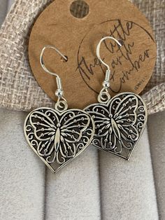 Costume earrings. Boho Butterfly dangling design which is zinc alloy in silver oxidised look and the actual earring hooks are 925 silver which are hypoallergenic. These are a lovely addition to any outfit. 40mm x 21mm  Comes in a drawstring bag. Adjustable Silver Heart Earrings, Nickel-free Metal Heart Earrings As Gift, Metal Heart Earrings Gift, Silver Heart-shaped Pierced Earrings, Antique Silver Pierced Sterling Silver Earrings, Oxidized Adjustable Dangle Earrings, Adjustable Oxidized Dangle Earrings, Hypoallergenic Metal Heart Drop Earrings, Vintage Silver Heart Metal Earrings