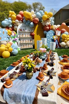 a table set up for an outdoor birthday party