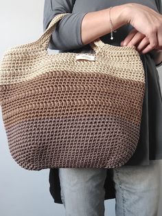 This crochet bag is a lovely handmade accessory that can be used to go grocery shopping, to go to the beach or to carry your stuff. It is an ideal gift for any occasion. This stylish shoulder bag offers plenty of room to store your things. It is opened at the top without inside lining Material: The bag is made out of 3mm polyester cord Cleaning and care: I recommend washing by hand with cold water and neutral soap. Leave to dry stretched out on a towel. Do not use a dryer machine. For more inten Big Shopper Bag, Unique Tote Bag, Knitting Group, Brown Tote Bag, Stylish Tote Bag, Plus Size Summer Outfit, Dryer Machine, Brown Tote, Stylish Shoulder Bag