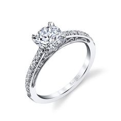 a diamond engagement ring on a white background