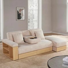 a living room with a couch, coffee table and window in the background on carpeted flooring