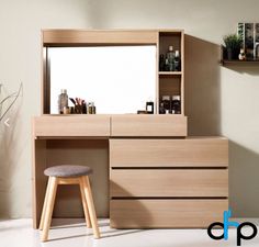 a wooden vanity with stool and mirror in a room