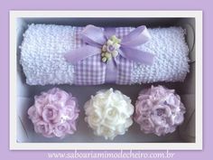 three different types of towels in a box with ribbons and bows on the top one