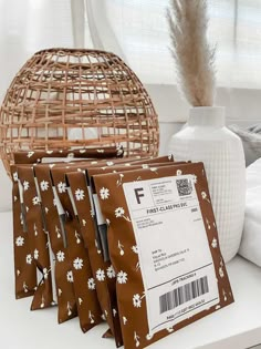 four bags of coffee sitting on top of a counter next to a wicker basket