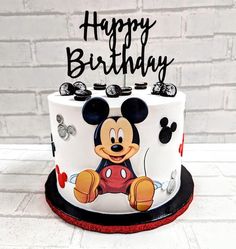 a mickey mouse birthday cake with the name happy birthday on it