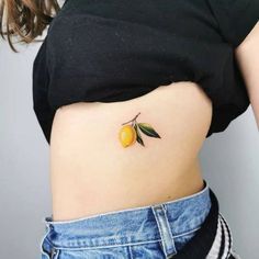 a woman with a small tattoo on her stomach