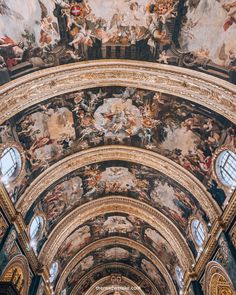 an ornate ceiling with paintings on it