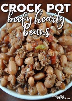 crock pot beefy hearty beans in a white bowl on a wooden table