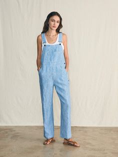 The perfect summer overalls are here. Lightweight linen is dyed with a faded washed indigo - paired with every little detail we could imagine to give these overalls true craftsmanship. Contrasting stitch accents lend a vintage authenticity, while antique brass hardware gives them a timeless appeal. Throw these on over your favorite tank or tee for the ultimate weekend outfit. This style is cut with an oversized fit, so if you're between sizes or want a slimmer fit, we recommend sizing down. Fit: Relaxed fit, Inseam 28". Based on customer reviews, we recommend sizing up Detail: Stripe Linen Overall with antique brass metal buckle closure at the shoulder straps Material: 100% Linen, Vintage Shank, Metal Strap Adjuster & Clasp Model: Alissa is 5’9 wearing size Small Care: Turn inside out Mach Summer Overalls, Swim Pants, Antique Brass Hardware, 4th Of July Outfits, Dress Shirts For Women, Weekend Outfit, Sweater Sale, Striped Linen, Shirt Sale