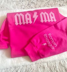 Gift your mom the perfect present this Mother's Day with the personalized crew neck with names on the sleeve.  Any mom would love this comfy soft pink MAMA sweater with their kids' name on the sleeve this season. It is perfect for snuggling and wearing out and about. Mama Sweatshirt Ideas, Diy Sweaters Vinyl, Mama Sweaters, Puff Vinyl Sweatshirt, Pink Crew Neck Sweatshirt For Mother's Day, Mother's Day Gift Sweatshirt With Custom Print, Mama Sweatshirt With Names, Mama Sweatshirt Pink, Mama Shirts Sweatshirts & Hoodies